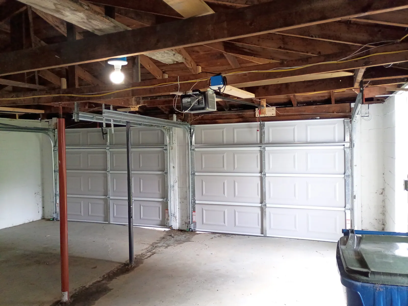 Ceiling-mounted garage door opener installed by Bear Door Services in Uniontown